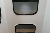 Interior of a 2007 Custom VSV with shelves and seating area.