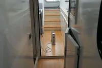 Interior of a 2007 Custom VSV boat with wooden flooring and compact design.