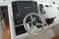 Steering console of 2007 Custom VSV boat with Raymarine navigation system.