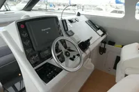Cockpit of 2007 Custom VSV boat with steering wheel and navigation equipment.