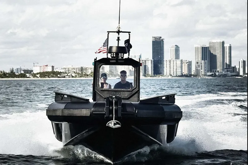  Yacht Photos Pics DGS 777 Military boat cruising near city skyline, 2022 model.