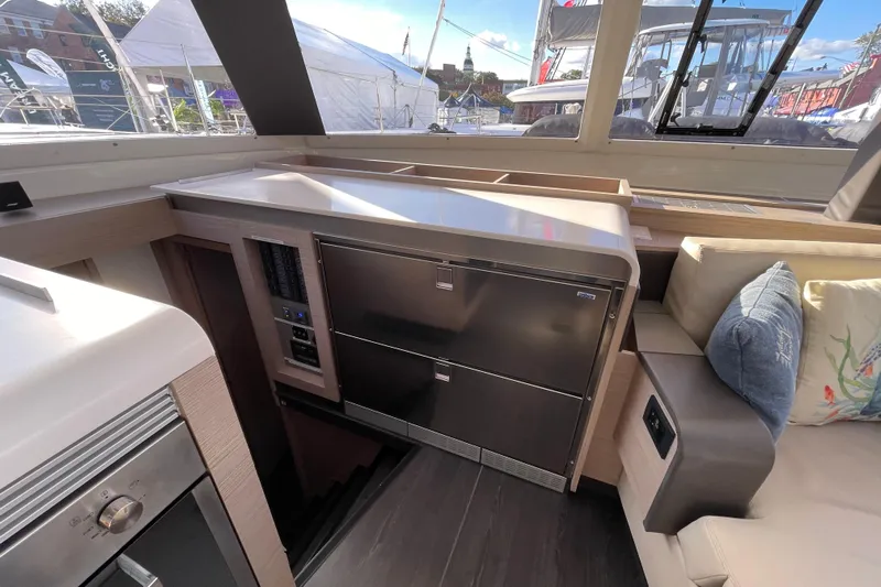 Zensation Yacht Photos Pics Interior of 2023 Fountaine Pajot Tanna 47 yacht with modern kitchen and seating area.