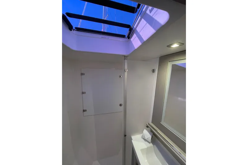 Zensation Yacht Photos Pics Modern bathroom interior of 2023 Fountaine Pajot Tanna 47 yacht with skylight.