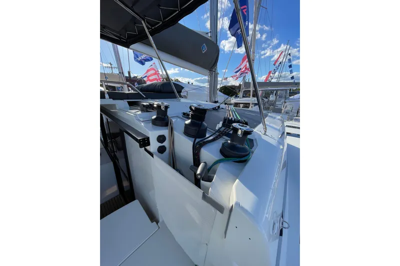 Zensation Yacht Photos Pics 2023 Fountaine Pajot Tanna 47 yacht deck with winches and ropes under a clear sky.
