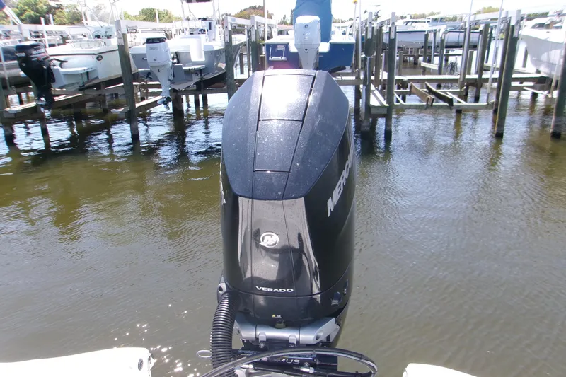  Yacht Photos Pics 2024 Sportsman Masters 267OE Bay Boat with Mercury Verado engine at dock.