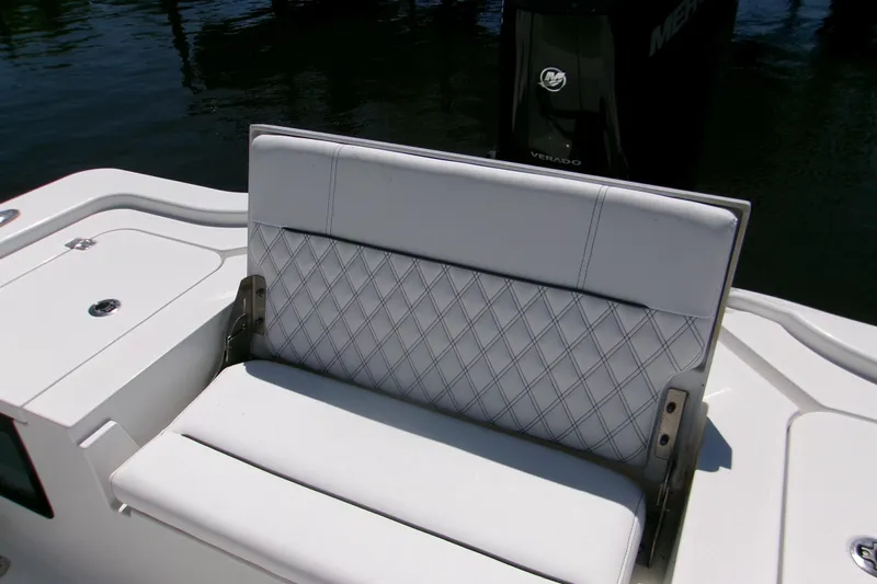  Yacht Photos Pics 2024 Sportsman Masters 267OE Bay Boat with cushioned seating and Verado engine.