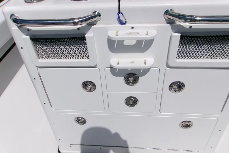  Yacht Photos Pics 2024 Sportsman Masters 267OE Bay Boat console with storage compartments and stainless steel handles.