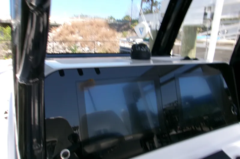  Yacht Photos Pics 2024 Sportsman Masters 267OE Bay Boat dashboard with modern navigation display.