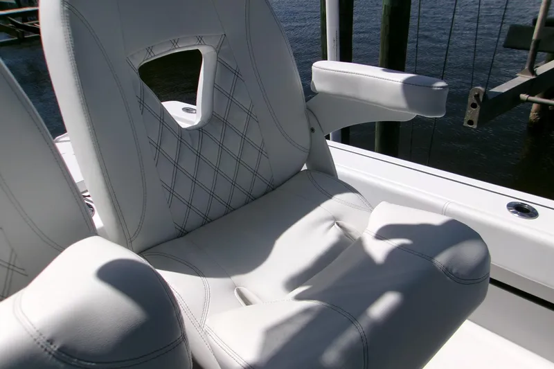  Yacht Photos Pics 2024 Sportsman Masters 267OE Bay Boat seat with elegant stitching and armrest.
