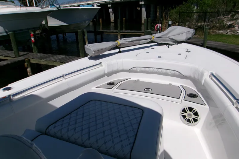  Yacht Photos Pics 2024 Sportsman Masters 267OE Bay Boat interior with cushioned seating and storage compartments.