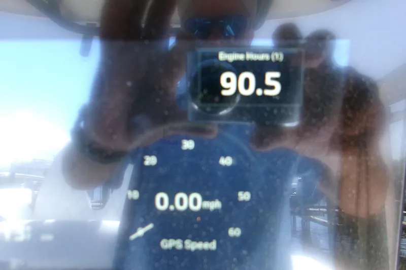  Yacht Photos Pics 2024 Sportsman Masters 267OE Bay Boat dashboard showing 90.5 engine hours and GPS speed.