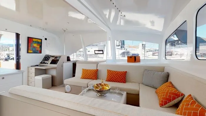 Ti Marin Yacht Photos Pics Luxurious interior of 2020 O Yachts Class 6 with modern seating and vibrant decor.