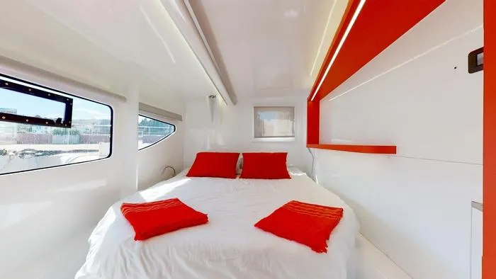 Ti Marin Yacht Photos Pics Luxurious cabin interior of 2020 O Yachts Class 6 with red accents and modern design.