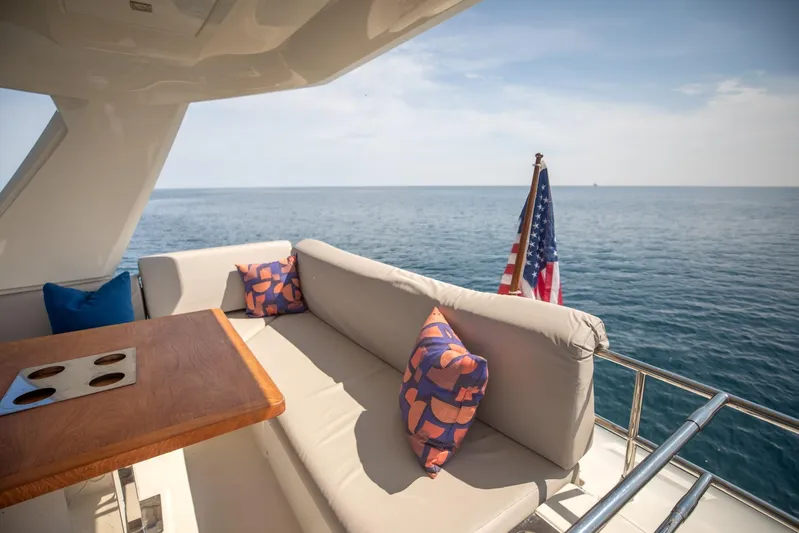 Yacht Photos Pics Luxurious 2020 Prestige 590 Flybridge Cruiser with elegant seating and ocean view.