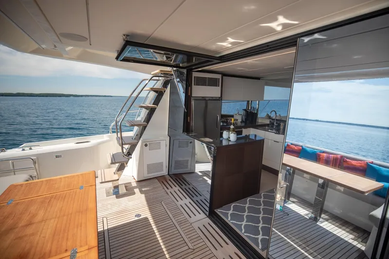  Yacht Photos Pics Luxurious 2020 Prestige 590 Flybridge Cruiser interior with modern kitchen and scenic ocean view.