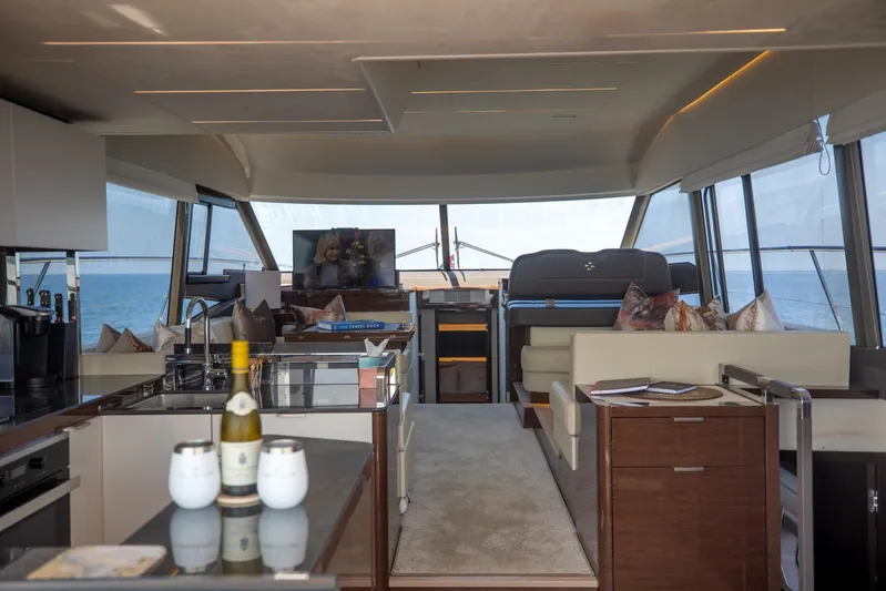  Yacht Photos Pics Luxurious interior of 2020 Prestige 590 Flybridge Cruiser with modern amenities and ocean view.