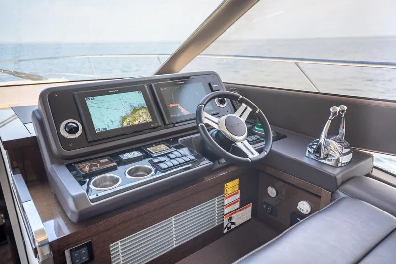  Yacht Photos Pics Helm of 2020 Prestige 590 Flybridge Cruiser with navigation screens and controls.