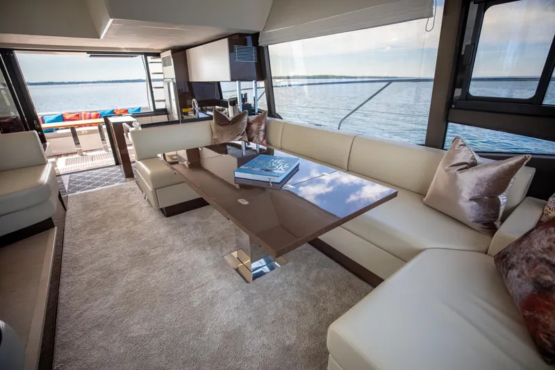  Yacht Photos Pics Luxurious interior of 2020 Prestige 590 Flybridge Cruiser with elegant seating and scenic ocean view.
