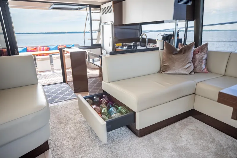  Yacht Photos Pics Luxurious interior of 2020 Prestige 590 Flybridge Cruiser with elegant seating and ocean view.