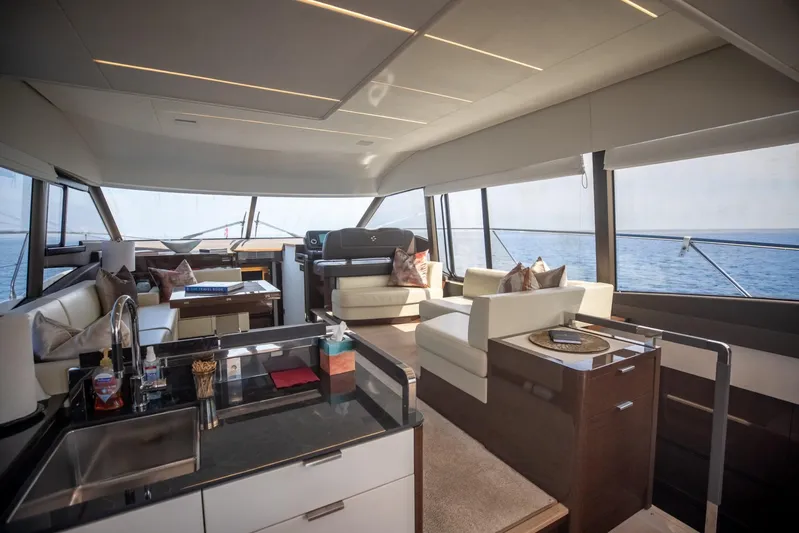  Yacht Photos Pics Luxurious interior of 2020 Prestige 590 Flybridge Cruiser with modern furnishings and ocean view.