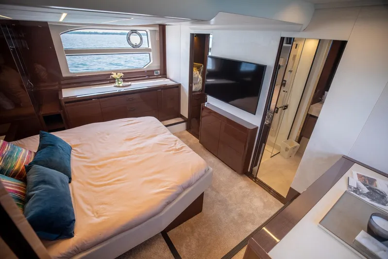  Yacht Photos Pics Luxurious bedroom interior of 2020 Prestige 590 Flybridge Cruiser with sea view window.