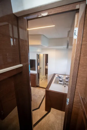  Yacht Photos Pics Interior view of 2020 Prestige 590 Flybridge Cruiser, showcasing elegant wood finishes and modern design.