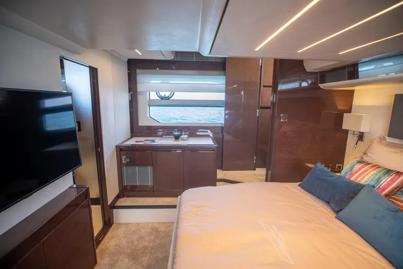  Yacht Photos Pics Luxurious interior of 2020 Prestige 590 Flybridge Cruiser with modern bedroom and sea view.