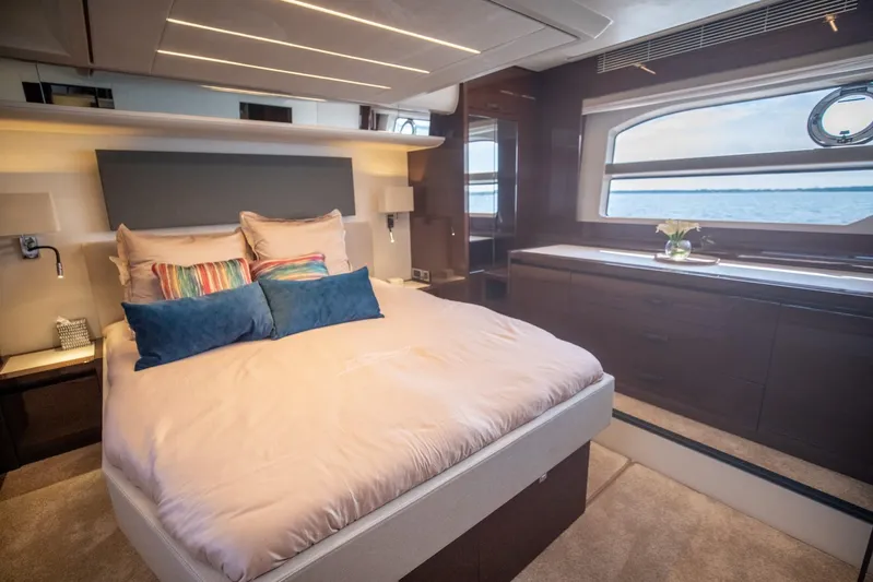  Yacht Photos Pics Luxurious bedroom interior of 2020 Prestige 590 Flybridge Cruiser yacht.