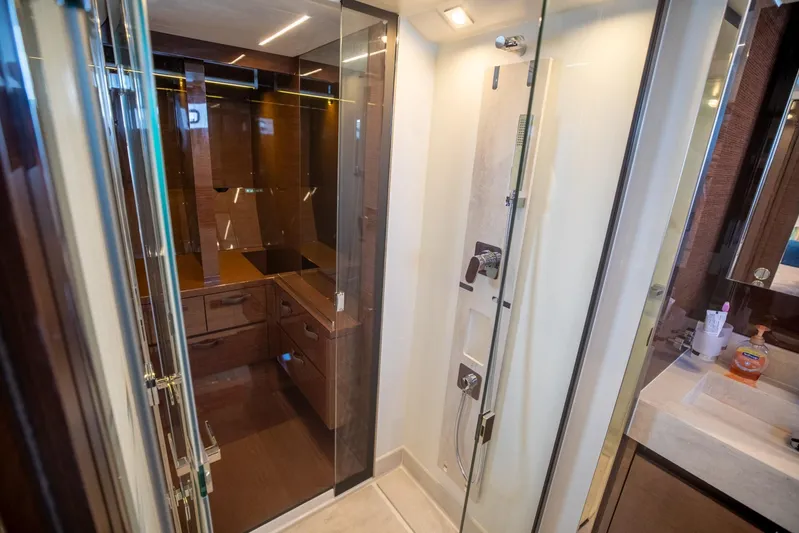  Yacht Photos Pics Luxurious bathroom interior of 2020 Prestige 590 Flybridge Cruiser yacht with modern shower.