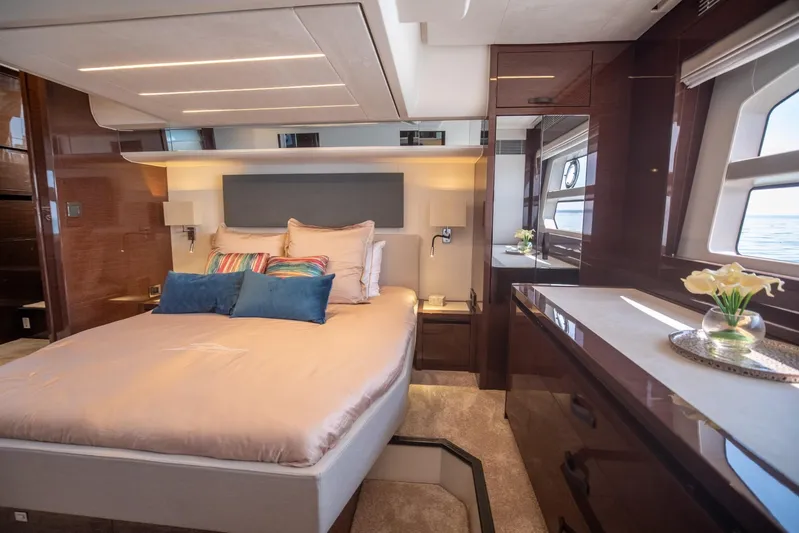  Yacht Photos Pics Luxurious bedroom interior of 2020 Prestige 590 Flybridge Cruiser with elegant decor and ocean view.
