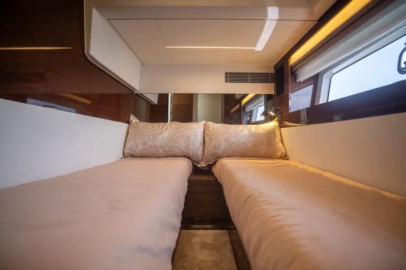 Yacht Photos Pics Luxurious interior of 2020 Prestige 590 Flybridge Cruiser with elegant twin beds.