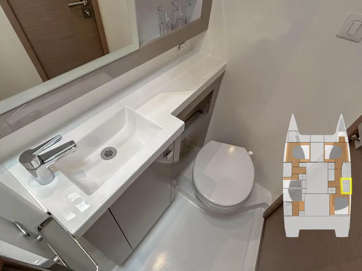 Yacht Photos Pics Bathroom interior of 2023 Fountaine Pajot Tanna 47 yacht with sink and toilet.