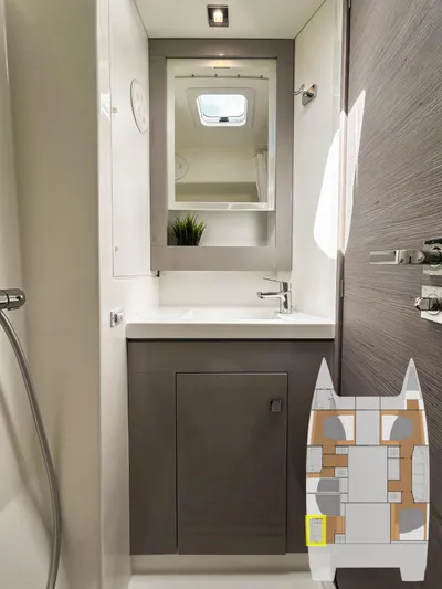  Yacht Photos Pics Bathroom interior of 2023 Fountaine Pajot Tanna 47 catamaran, featuring modern fixtures and a sleek design.