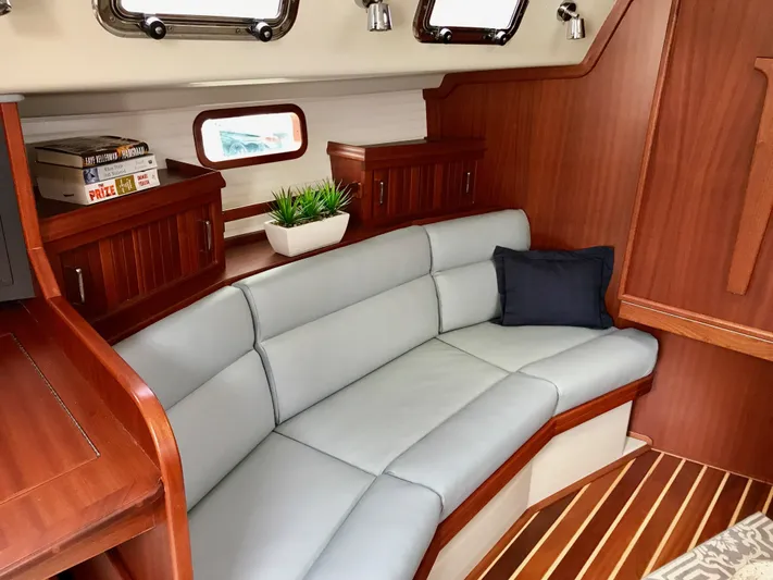 Salacia Yacht Photos Pics Luxurious interior of 2016 Blue Jacket 40 yacht with plush seating and wooden cabinetry.