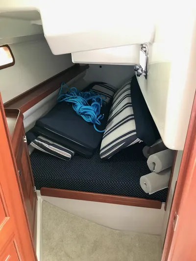 Salacia Yacht Photos Pics Interior cabin of 2016 Blue Jacket 40 sailboat with cushions and blue rope.