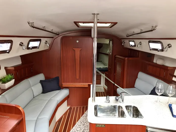 Salacia Yacht Photos Pics Luxurious interior of a 2016 Blue Jacket 40 sailboat with elegant wood finishes.