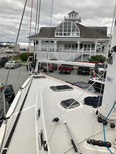 Salacia Yacht Photos Pics Sailboat docked near a marina building, Blue Jacket 40, 2016 model.