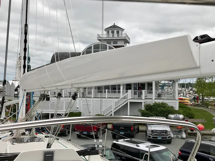 Salacia Yacht Photos Pics Sailboat Blue Jacket 40, 2016 model, docked near a marina building under cloudy skies.