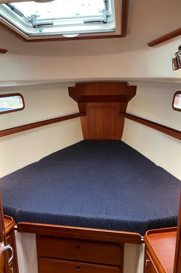 Salacia Yacht Photos Pics Cozy cabin interior of 2016 Blue Jacket 40 sailboat with wooden finish and skylight.