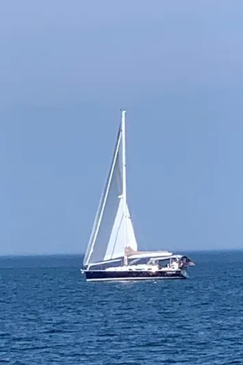 Salacia Yacht Photos Pics Sailboat on open sea, Blue Jacket 40, 2016 model, clear blue sky.
