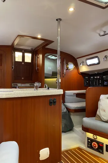 Salacia Yacht Photos Pics Interior of 2016 Blue Jacket 40 sailboat with wood finish and modern amenities.