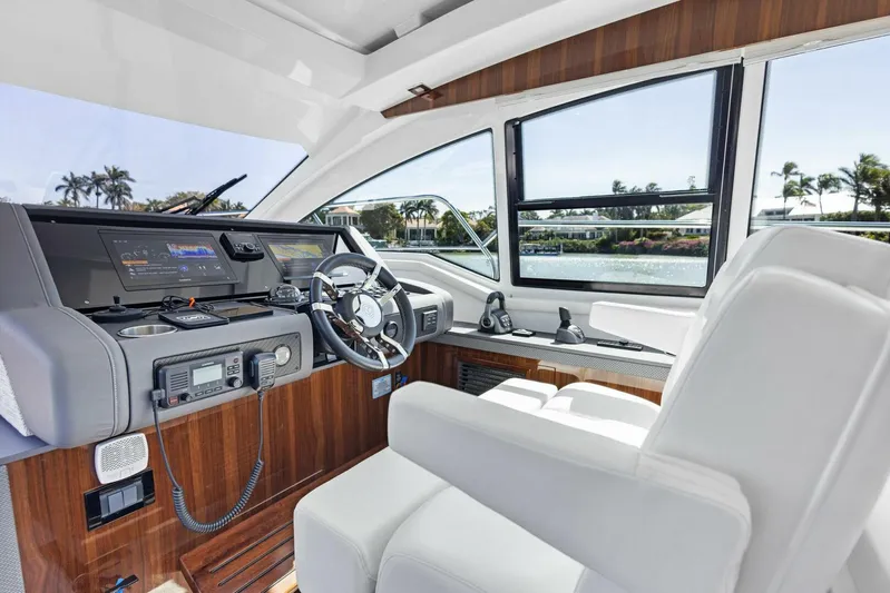 Bradventures Yacht Photos Pics 2023 Cruisers Yachts 42 Cantius helm with modern controls and luxurious seating.