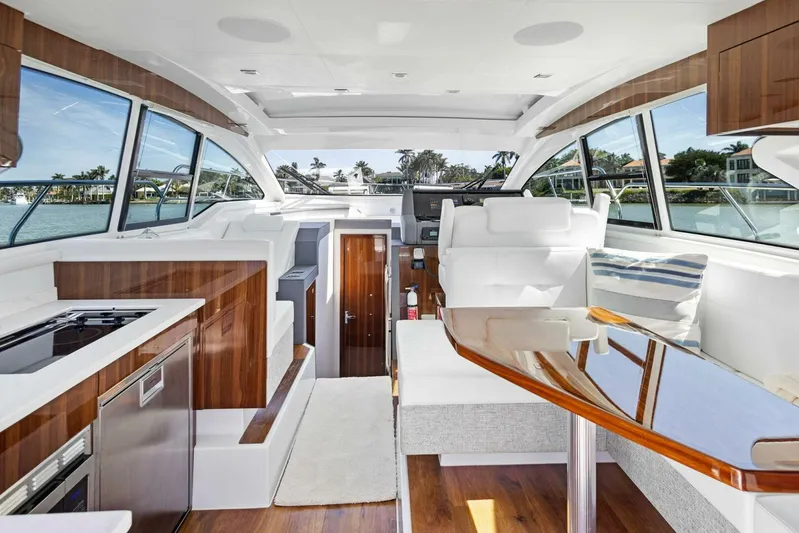 Bradventures Yacht Photos Pics Luxurious interior of 2023 Cruisers Yachts 42 Cantius with modern design and panoramic windows.