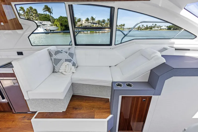 Bradventures Yacht Photos Pics Luxurious interior of 2023 Cruisers Yachts 42 Cantius with waterfront view.