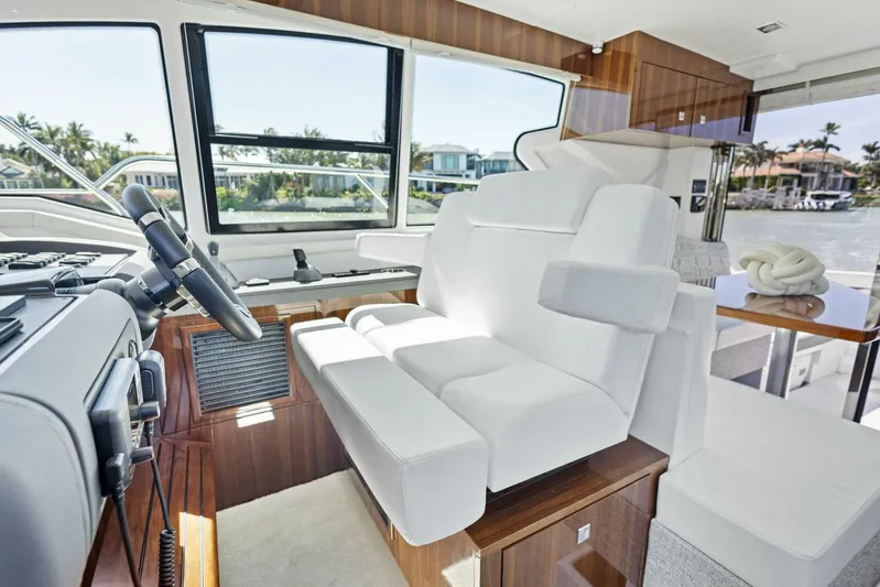 Bradventures Yacht Photos Pics Luxurious interior of 2023 Cruisers Yachts 42 Cantius with plush seating and modern helm.