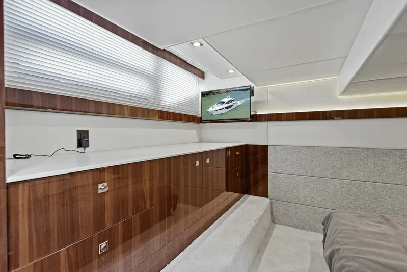 Bradventures Yacht Photos Pics 2023 Cruisers Yachts 42 Cantius interior with wood cabinetry and mounted TV.