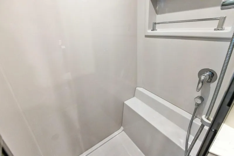 Bradventures Yacht Photos Pics 2023 Cruisers Yachts 42 Cantius shower interior with modern fixtures and seating.