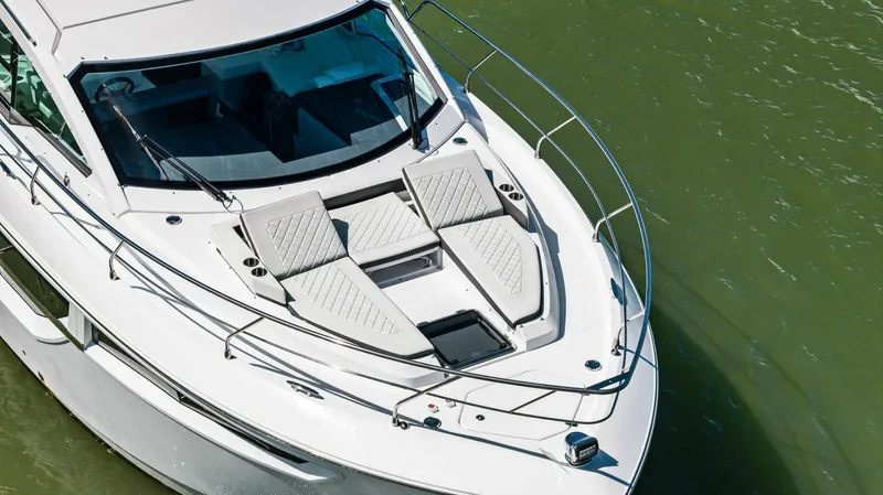 Bradventures Yacht Photos Pics 2023 Cruisers Yachts 42 Cantius, aerial view of sleek deck design on water.