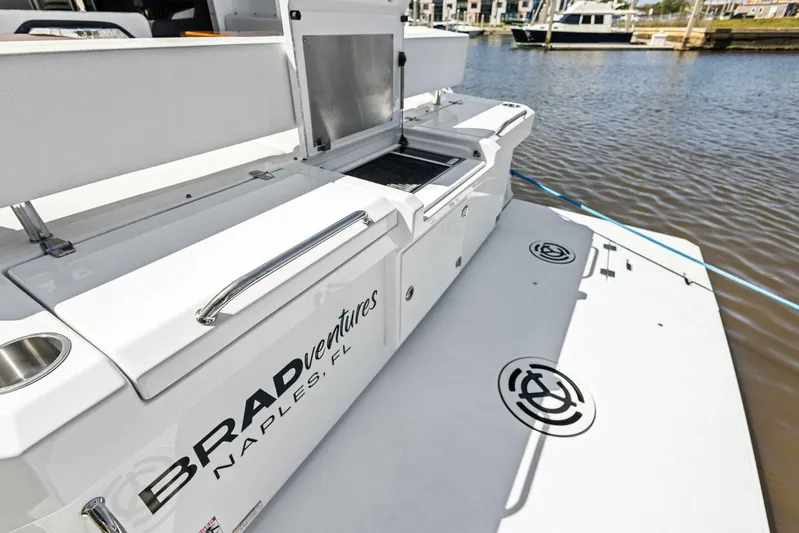 Bradventures Yacht Photos Pics 2023 Cruisers Yachts 42 Cantius on water, featuring deck and storage area.