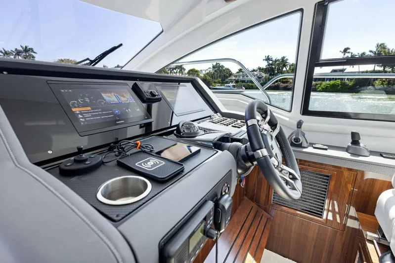 Bradventures Yacht Photos Pics 2023 Cruisers Yachts 42 Cantius helm with modern controls and sleek design.
